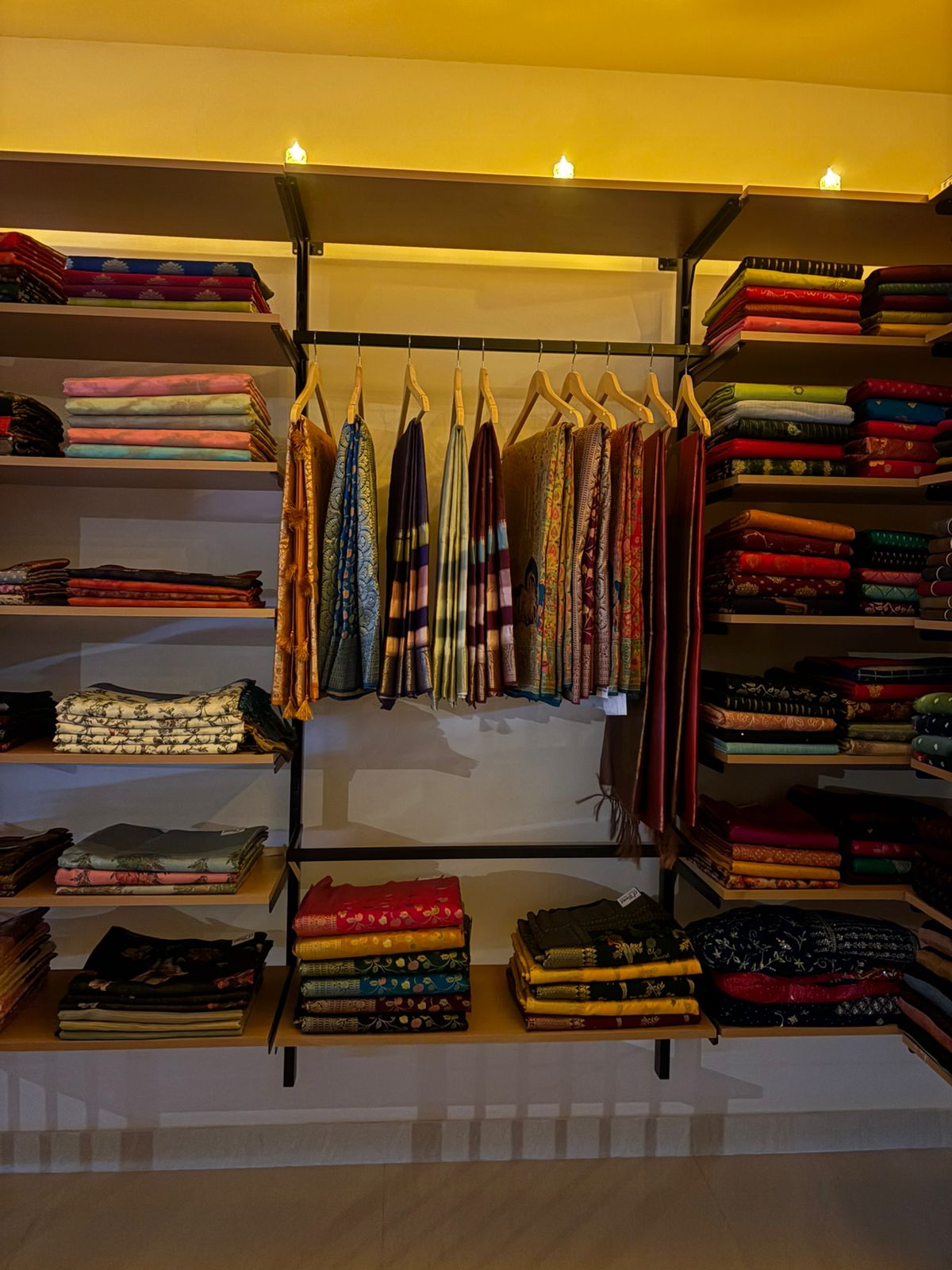 Close-up shelves with silks and festive wear