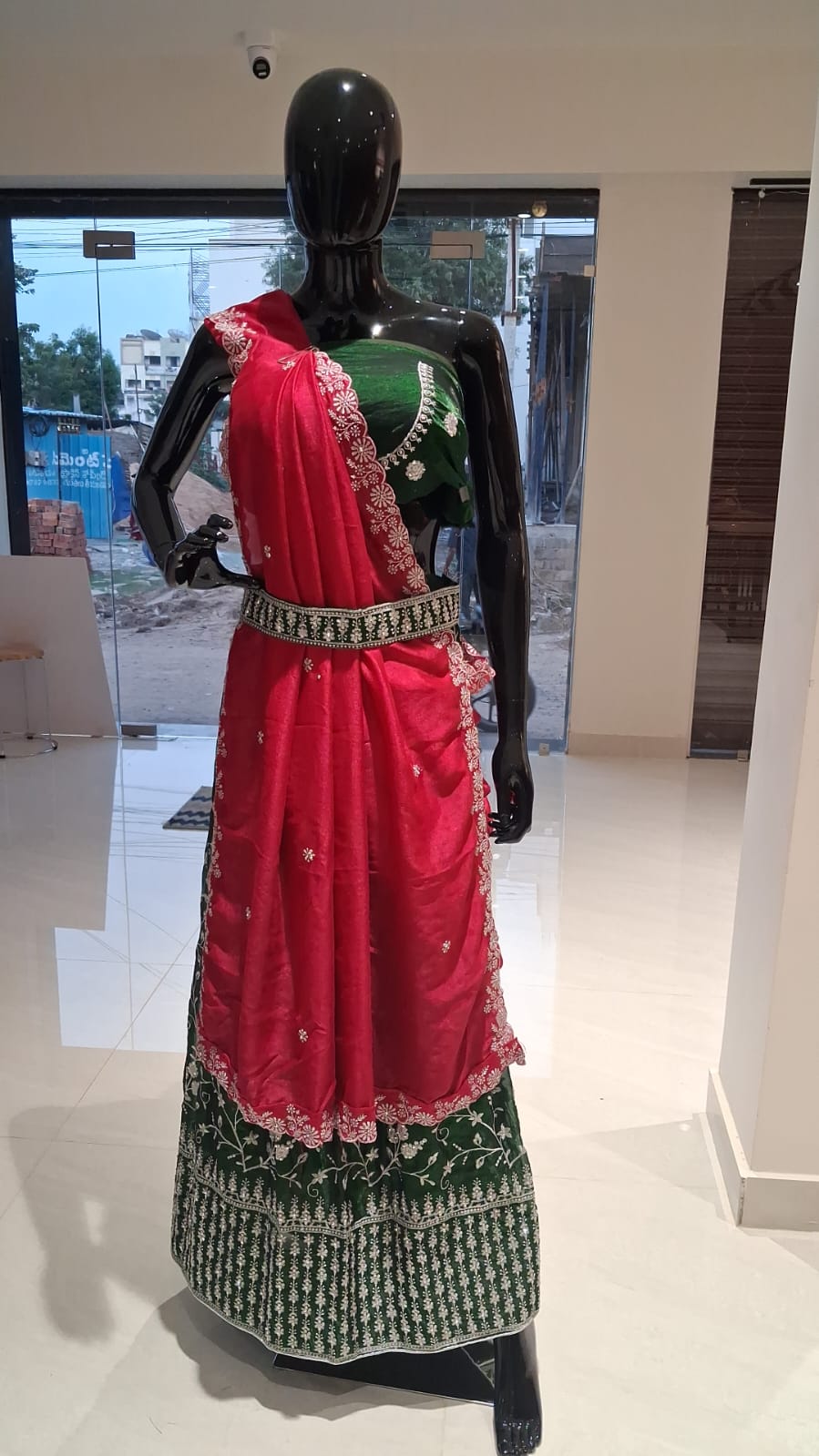 Bridal lehenga on mannequin with couture detailing