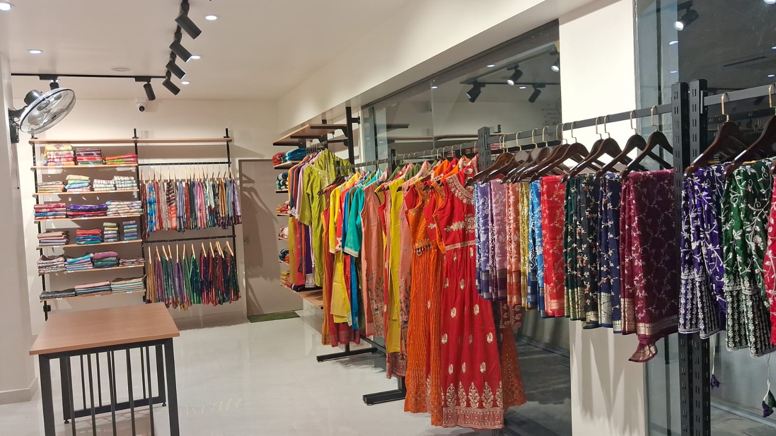 Premium fabric wall with curated sari racks